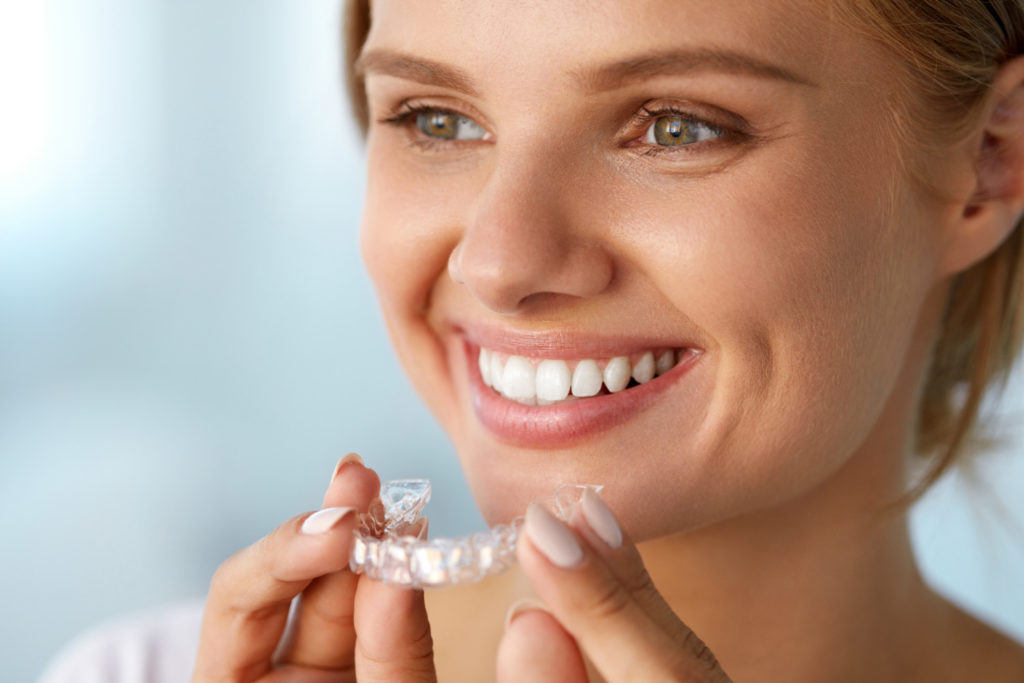 Young blonde lady with Invisalign