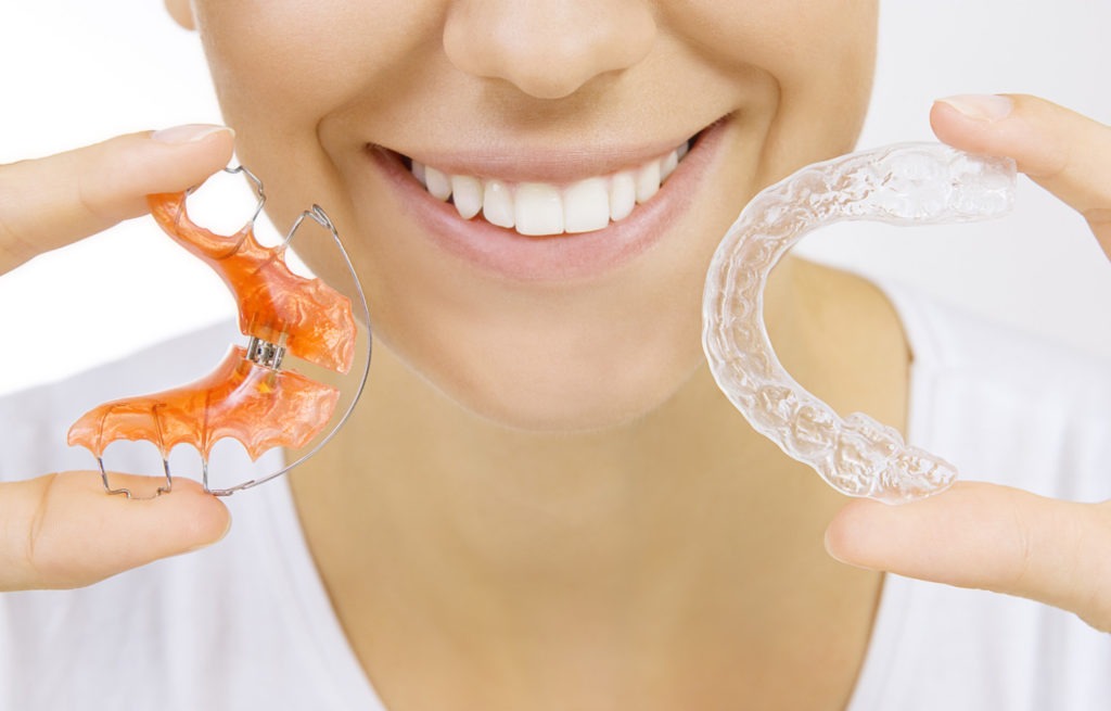 Comparing a retainer to an Invisalign aligner