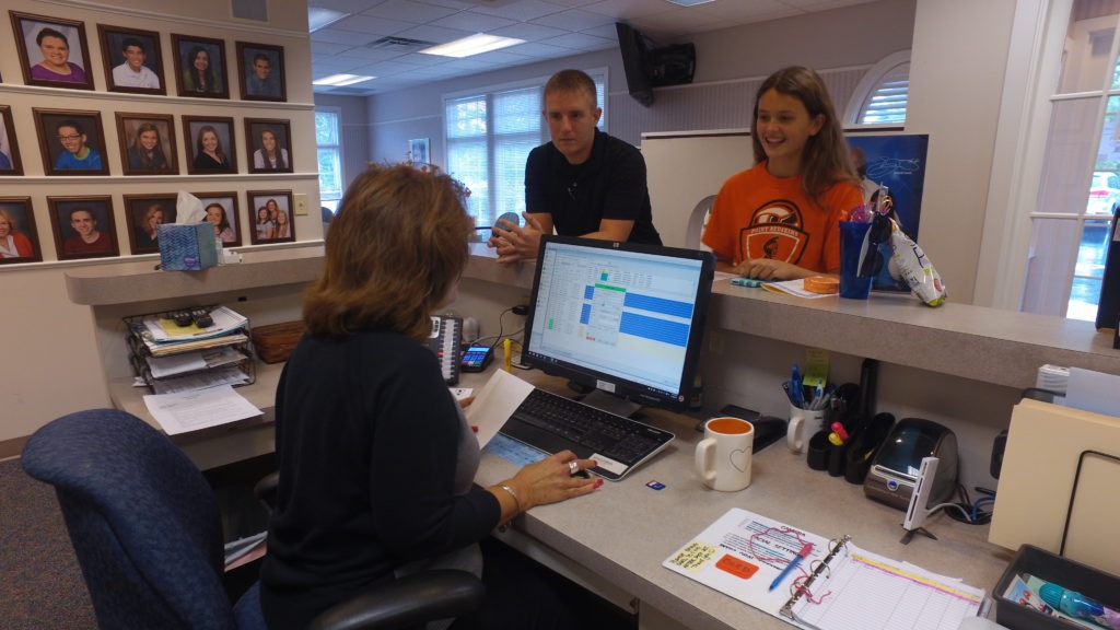 Thacker Orthodontics staff checking out a patient