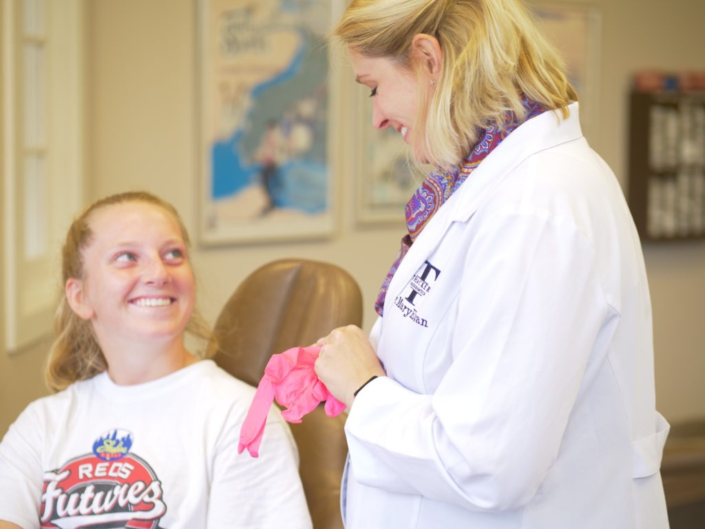 Dr. MaryEvan working with a client