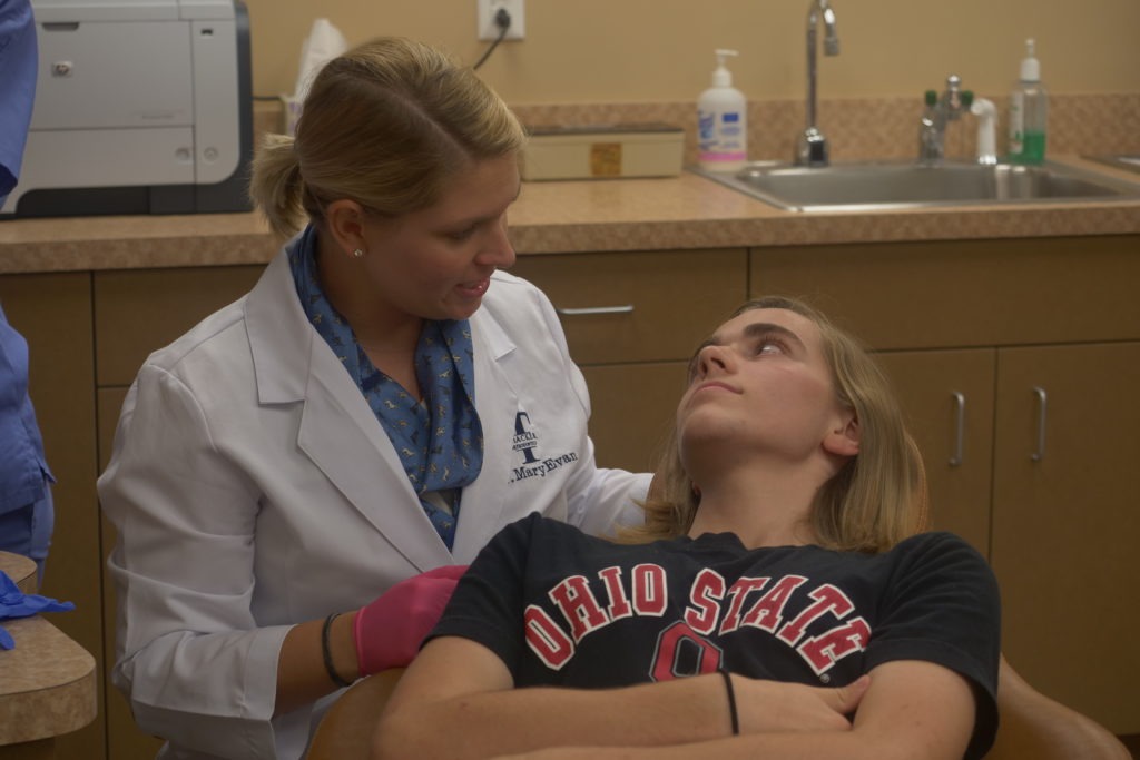 Dr. MaryEvan working with a patient