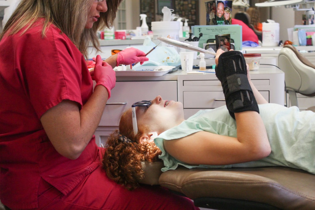 girl smiling at her new braces