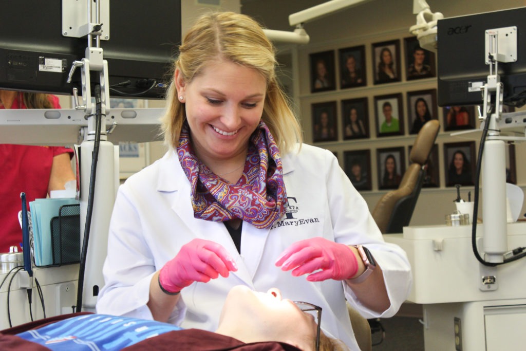 Dr. MaryEvan working with a patient