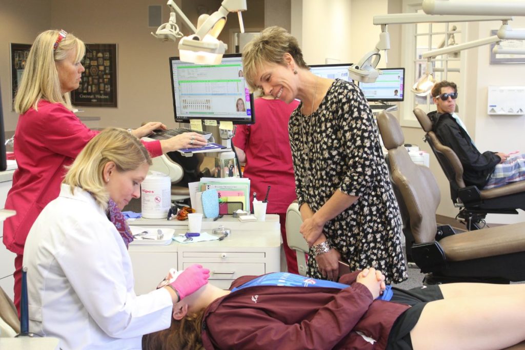 Dr. MaryEvan talking to a patient's mom