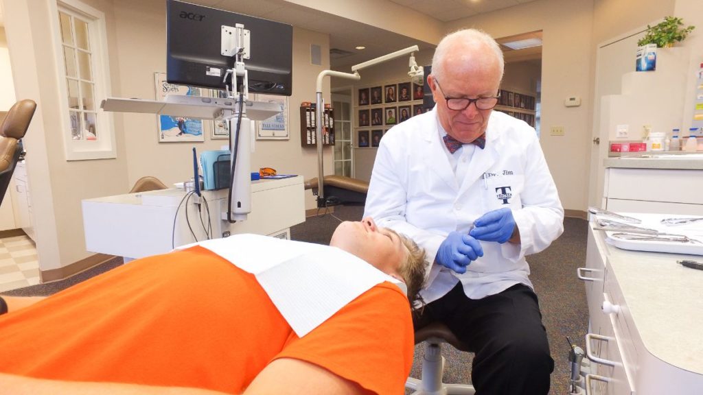 Dr. Thacker working on a patient's teeth